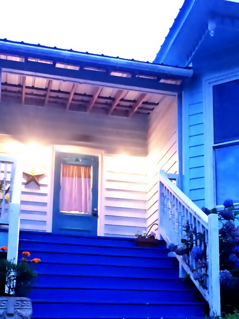 steps up to southern porch and front door with haint blue colors